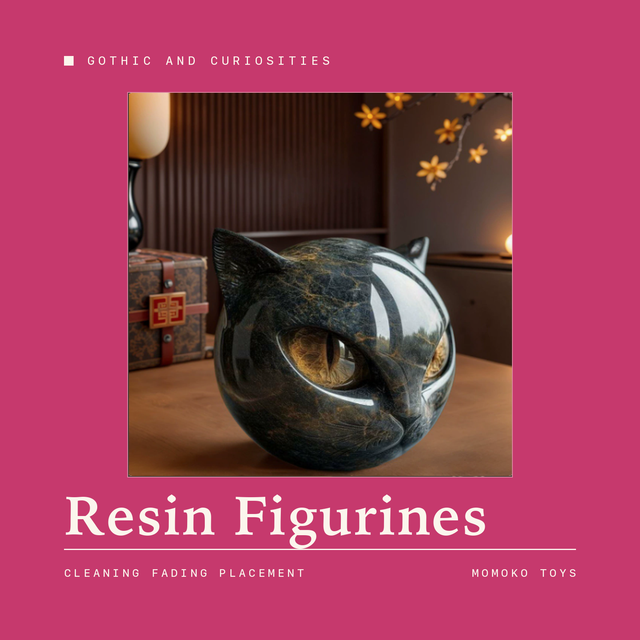 Black resin cat figurine with gold-flecked finish on a wooden table